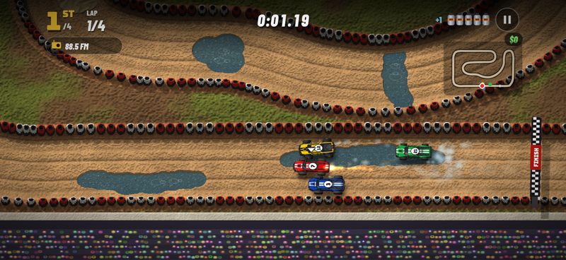 The red truck fires its nitro as all four trucks race side by side through a shallow stream on River Run, toward the finish line